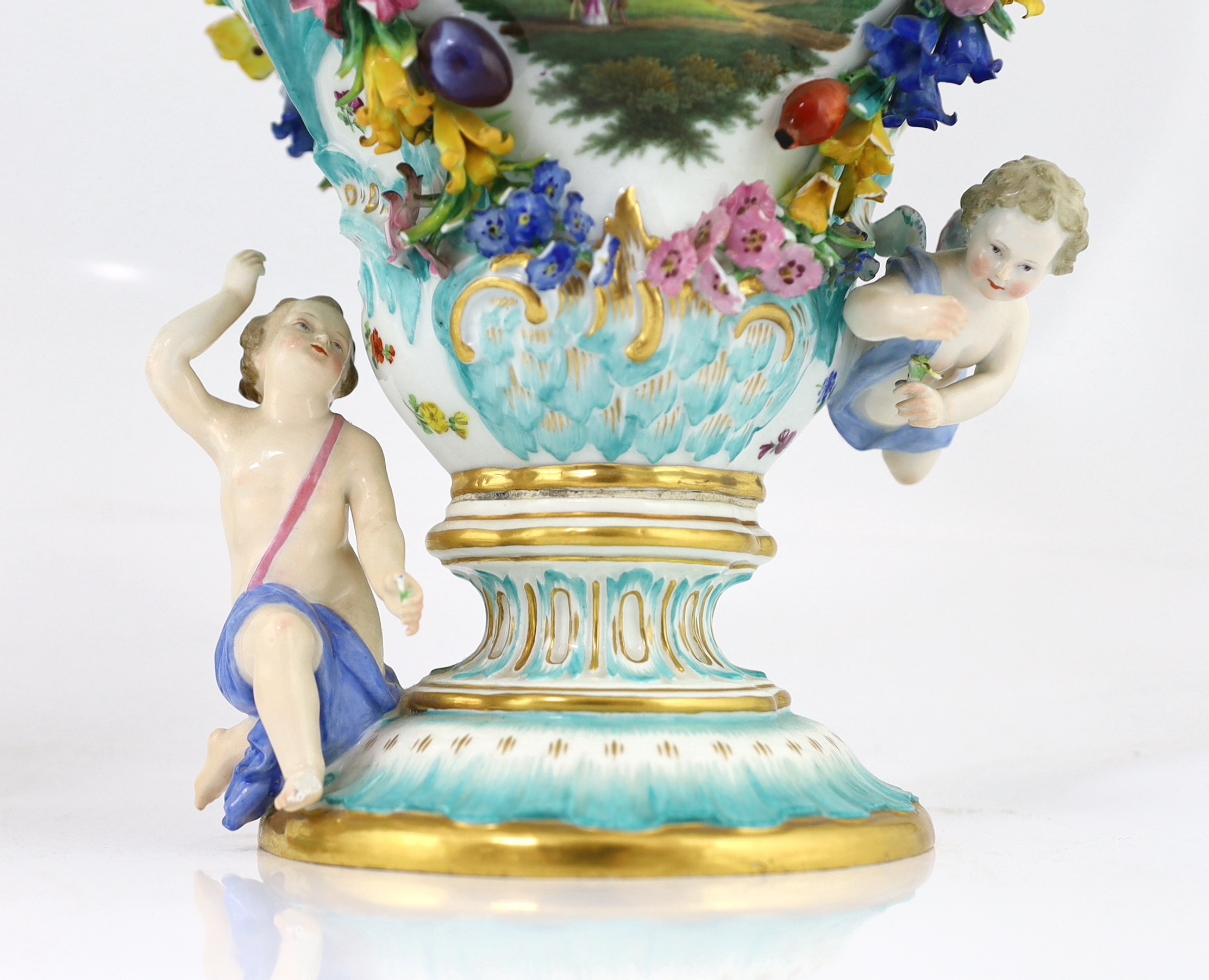 A pair of Meissen topographical flower encrusted vases and covers, 19th century, losses